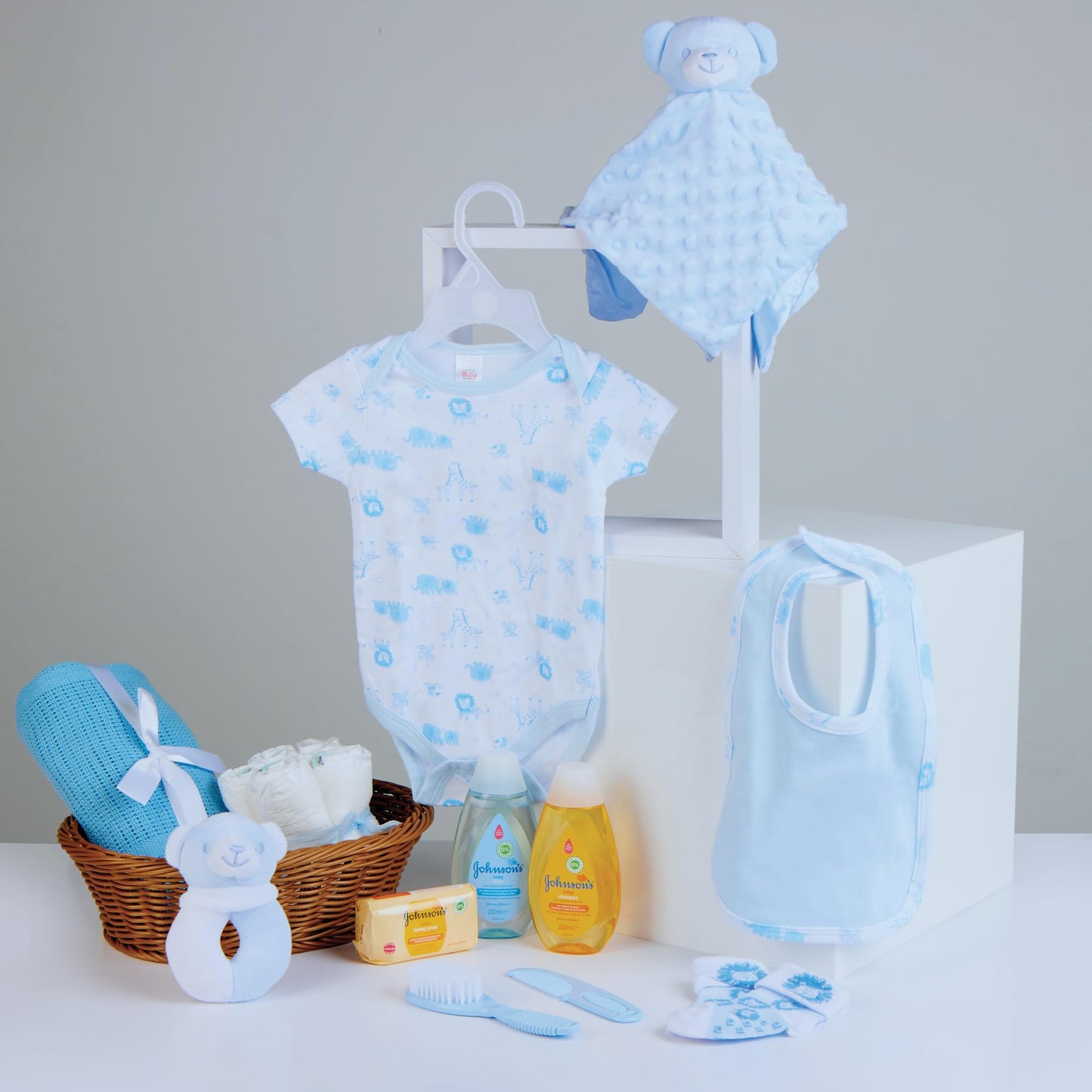 Baby Box Shop - 17 Baby Essentials for Newborn Boy Perfect as Christenings - Baby Boy Gifts, Baby Hamper for Newborn Boy in Rattan Basket (Blue) Standard Blue